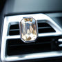 Luxury crystal car Fragrance clipped onto a car air vent with brilliant prism reflections