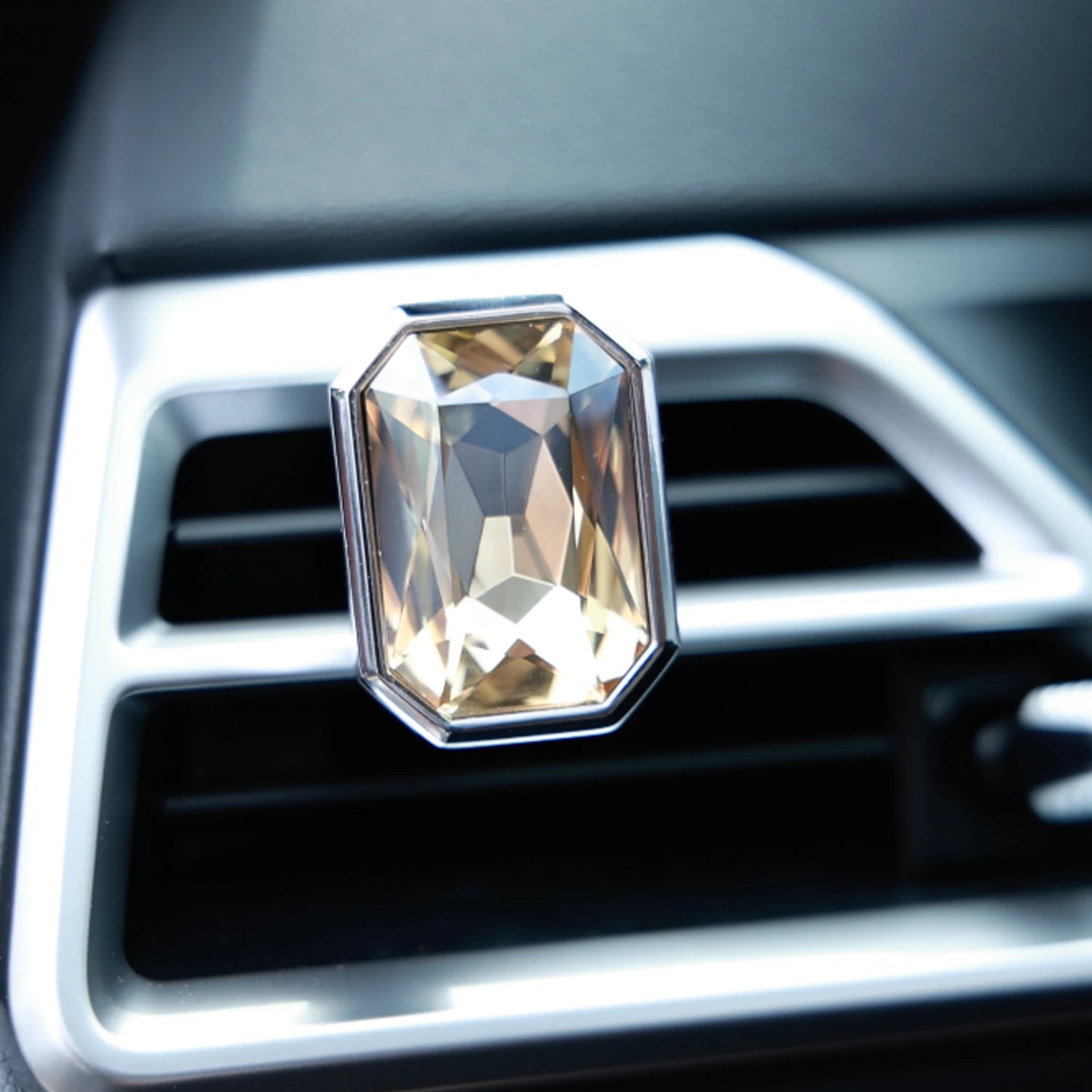 Luxury crystal car Fragrance clipped onto a car air vent with brilliant prism reflections