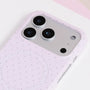 Close-up of the blush pink polka dot phone case camera area with pastel finish and refined dotted pattern.