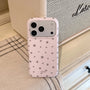Blush pink matte star phone case with silver star print displayed beside a speaker