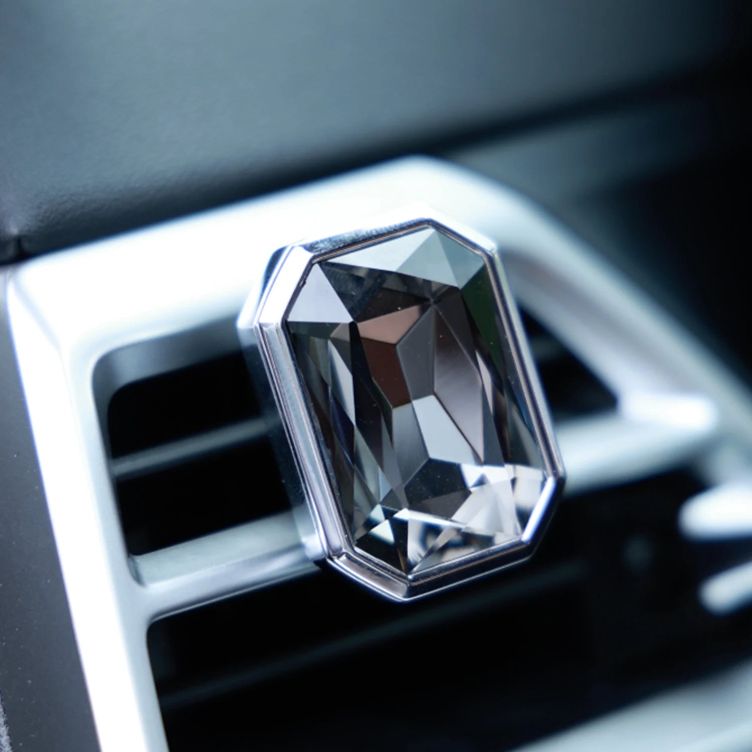 Luxury crystal car Fragrance clipped onto a car air vent with brilliant prism reflections