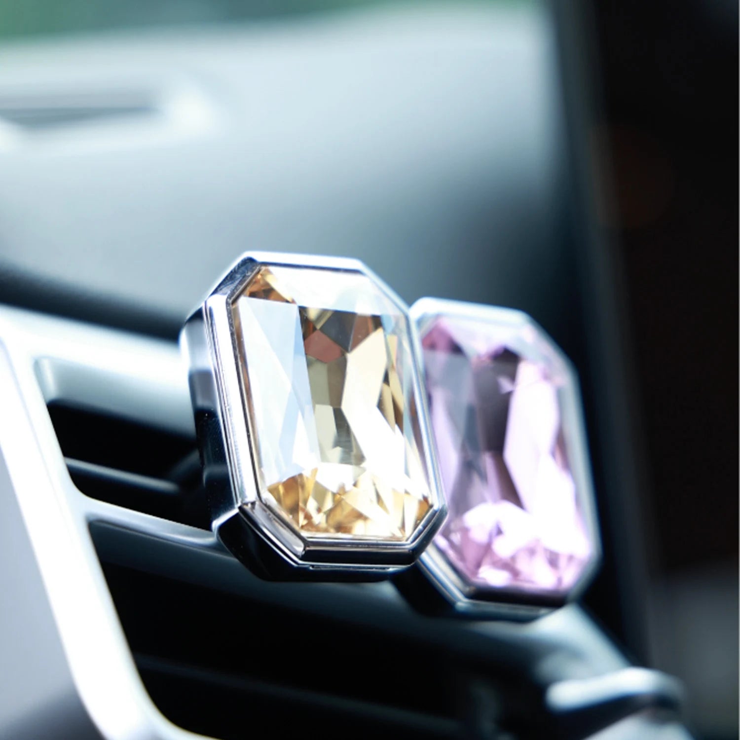 Luxury crystal car Fragrance clipped onto a car air vent with brilliant prism reflections