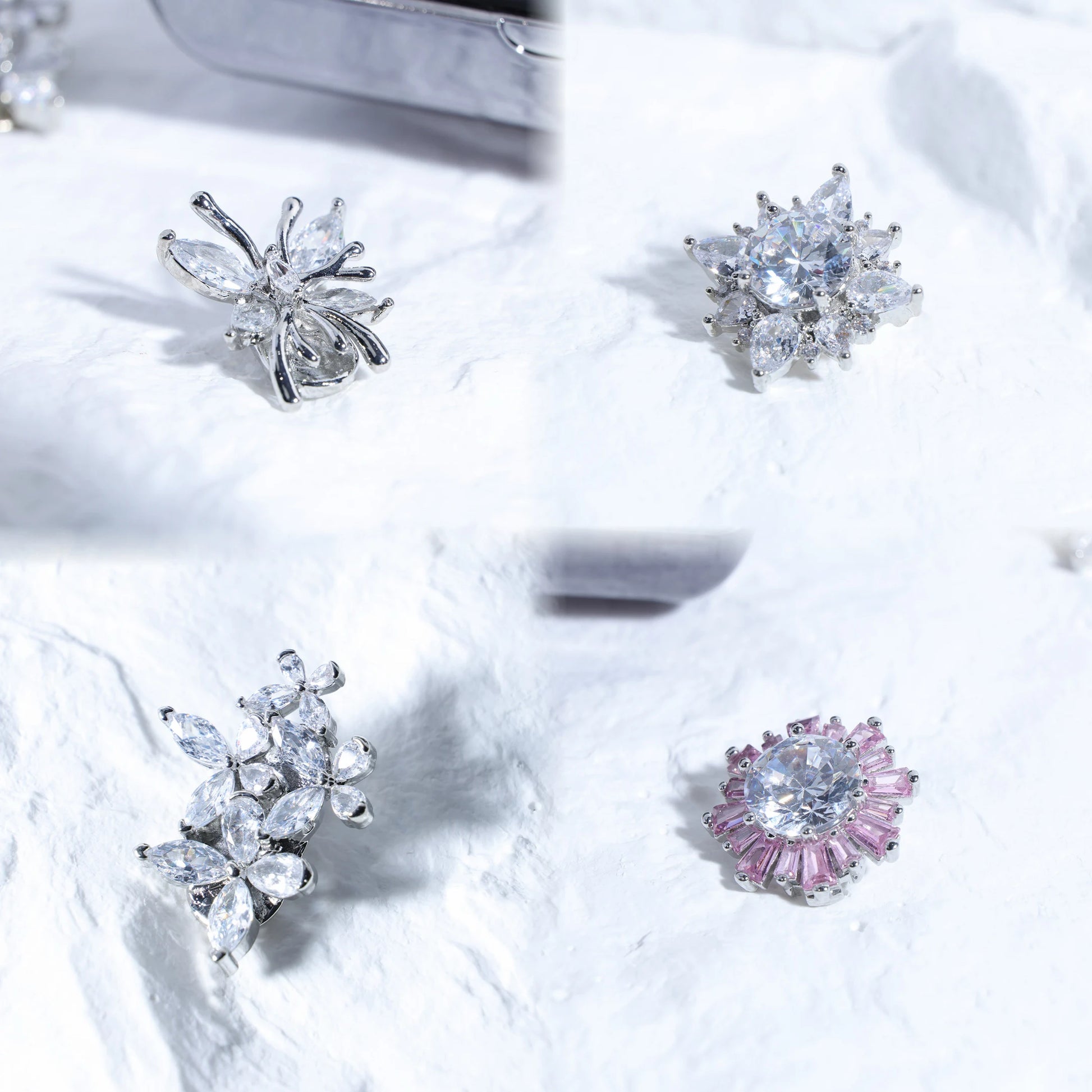 Close-up of Interstella Crystal Aura Bluetooth ear jewelry showing interchangeable crystal accessories and magnetic attachment