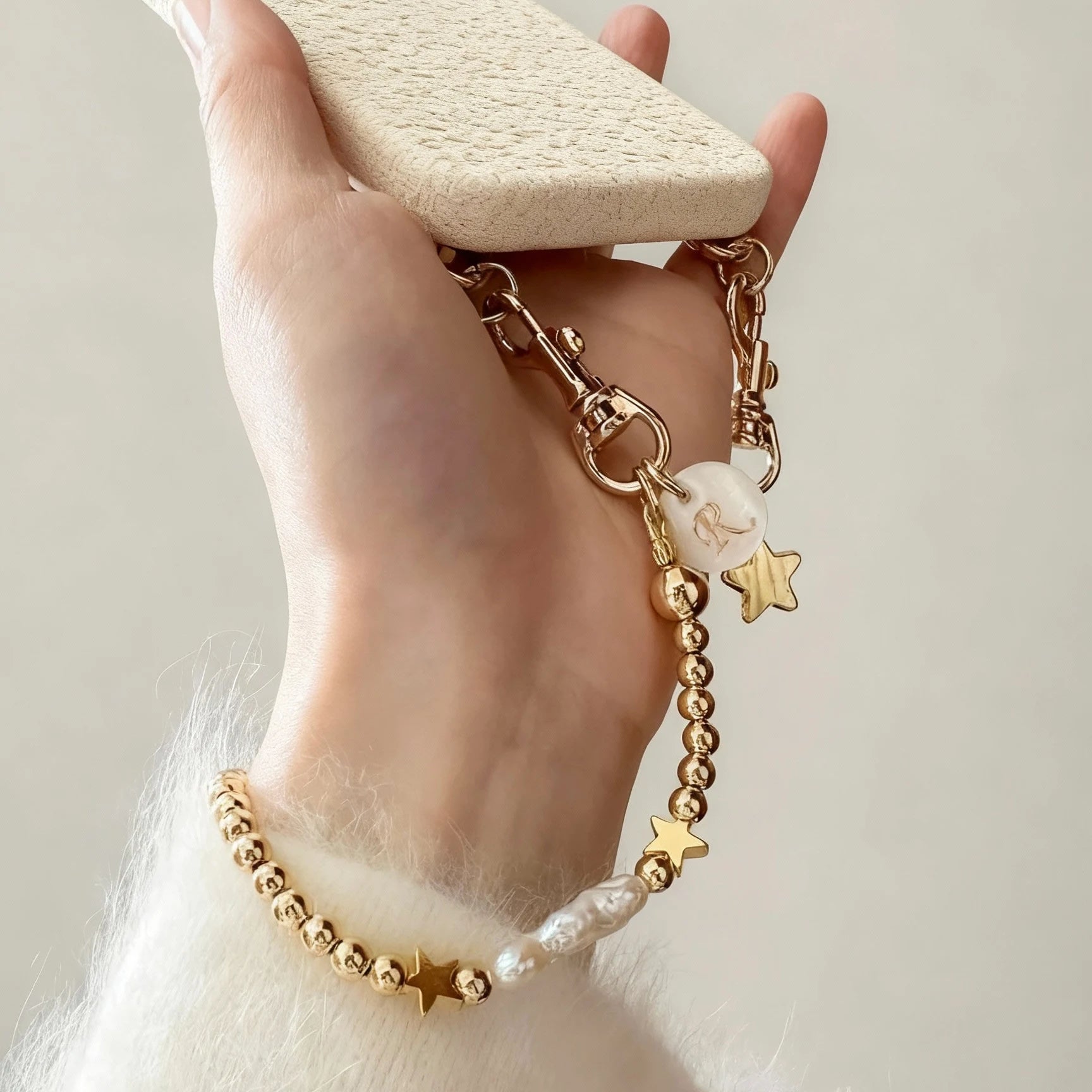 18K gold phone strap with round beads and dual star charms, detachable bracelet design