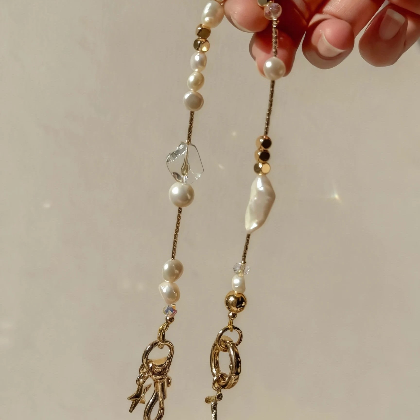 Pearl and white quartz phone strap with gold star charm