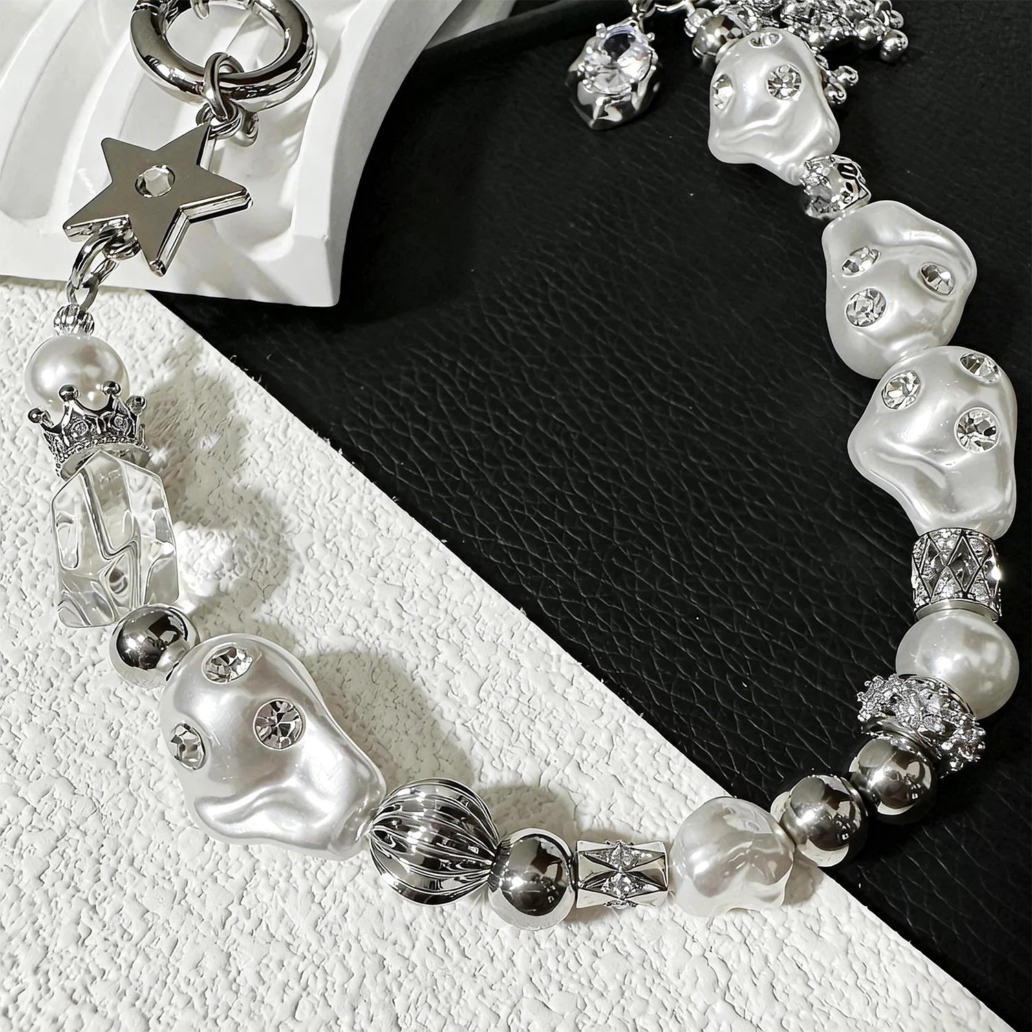 Star-shaped metal and pearl embellished phone strap with mixed metallic bead detailing