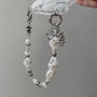 Star-shaped metal and pearl embellished phone strap with mixed metallic bead detailing