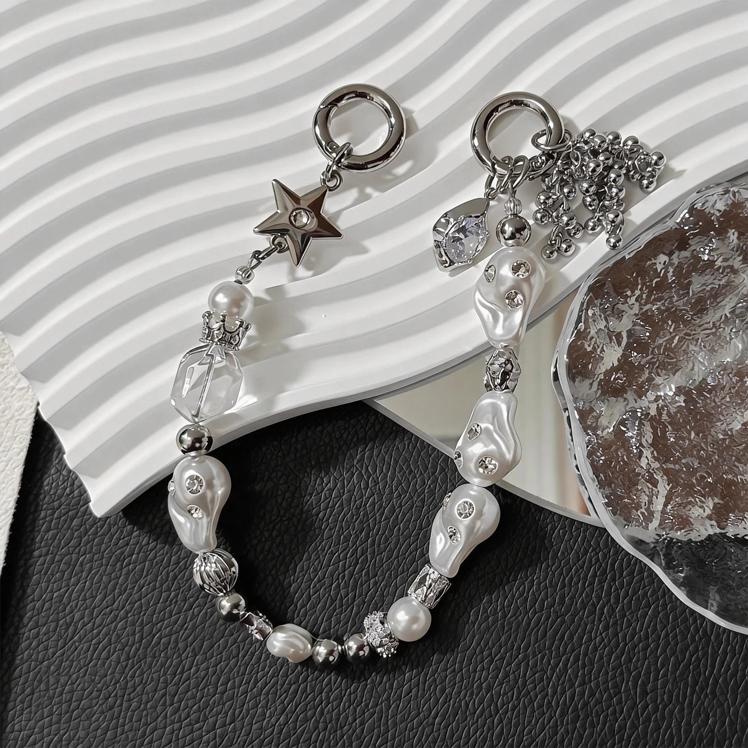 Star-shaped metal and pearl embellished phone strap with mixed metallic bead detailing